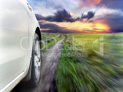 View of the front of a silver car while driving fast