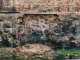 old crumbling brick wall as background