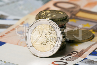 some banknotes on five and fifty euros and coins