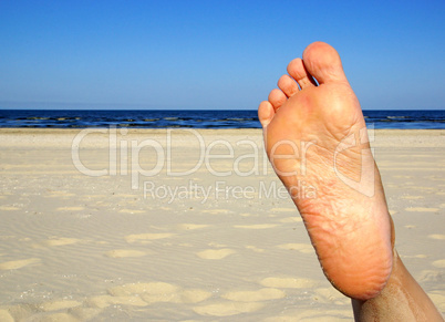 Fuß mit Strand und Meer
