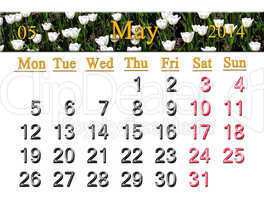 calendar for may of 2014 with tulips on the flower-bed
