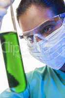 Asian Female Scientist & Green Test Tube In Laboratory