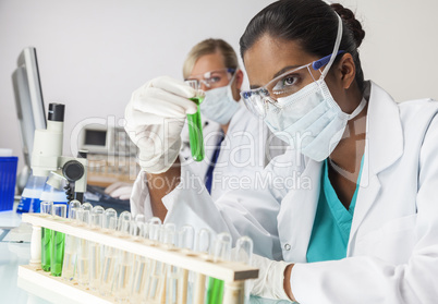 Asian Indian Female Laboratory Scientist Green Test Tube
