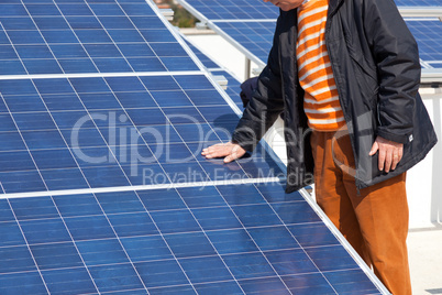 Hand on solar panel