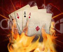 Poker cards burn in the fire