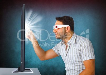 Man Wearing 3d Glasses touches the tv