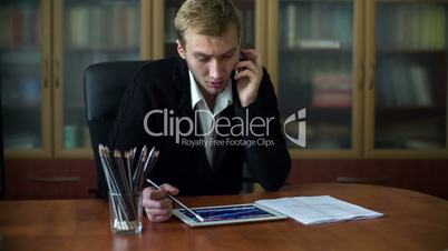 Businessman On The Phone While Working 1