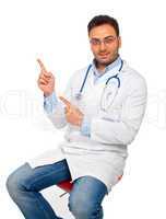 Handsome young doctor pointing