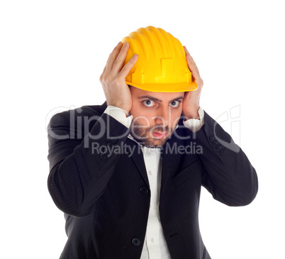 Frightened businessman with construction helmet