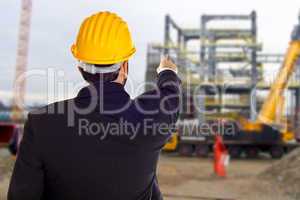Businessman with construction helmet