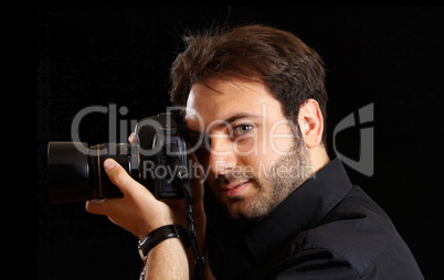 Portrait of a handsome young man with camera