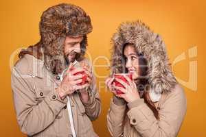 portrait of a couple wearing a winter coats