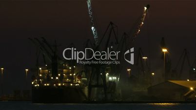 unloading cargo ship at night 1