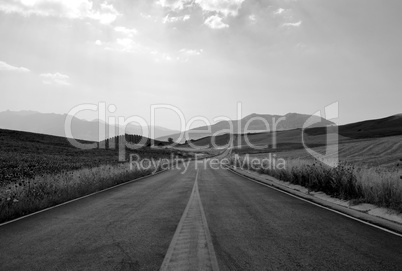 Desert road between mountains