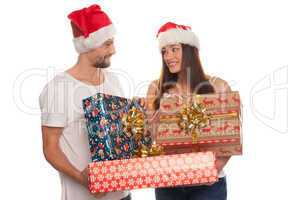 smiling young couple with large xmas gifts