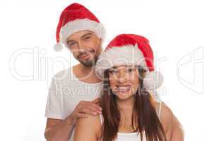 charming young couple in red santa hats