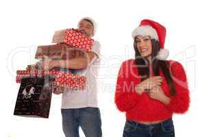 young couple laden with christmas presents