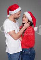 loving young couple in red santa hats