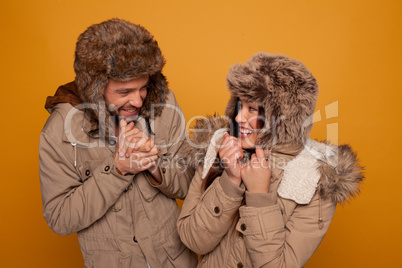 happy couple in warm winter clothing