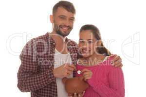 young couple with their piggy bank