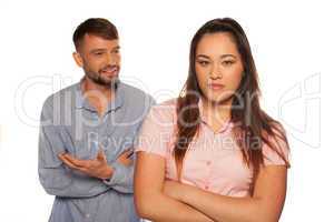 young couple having an argument with man talking