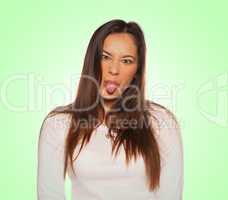 young woman sticking the tongue out