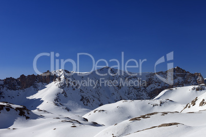 Snowy mountains and blue sky in morning