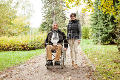 woman next to man in wheelchair
