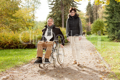 woman next to man in wheelchair