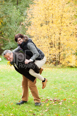 happy couple in the autumn park
