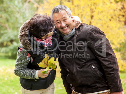 happy couple in the autumn park