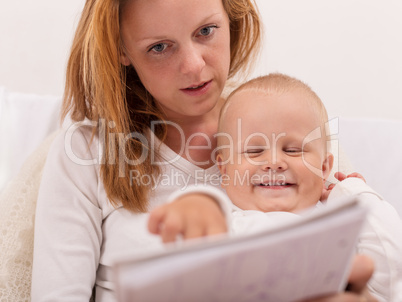 young mother is drawing with her son