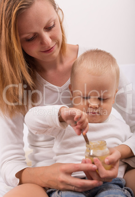 baby boy  eats with a spoon