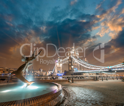 London. Girl with Dolphin Fountain and gorgeous view of Tower Br