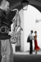 saxophone player with romantic couple