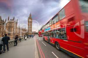 Iconic Red Double Decker Bus speeding up in Westminster Bridge a
