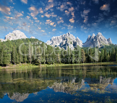 Beautiful alpin landscape. Mountain peaks reflected into a lake