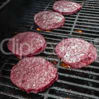 tasty beef burgers on the grill