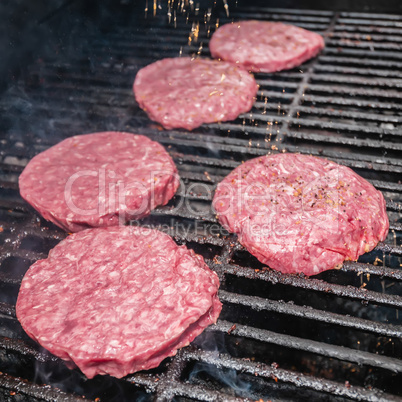 tasty beef burgers on the grill
