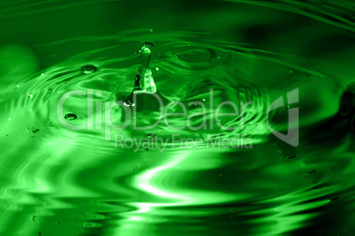 green multi colored water drop bubbling