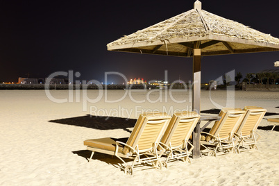 beach night illumination with a view on palm jumeirah, dubai, ua