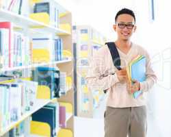 southeast asian adult student in library