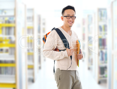 asian adult student in library