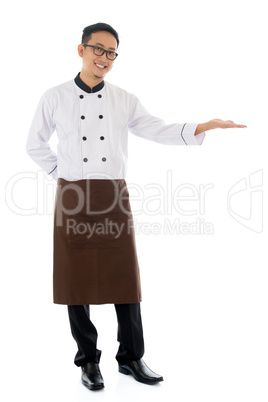 asian male chef hand showing blank space