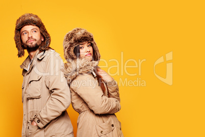 Loving couple on yellow background