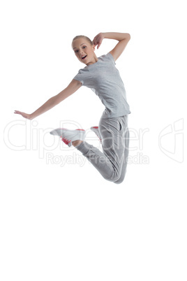 Sporty girl jumping in studio isolated on white