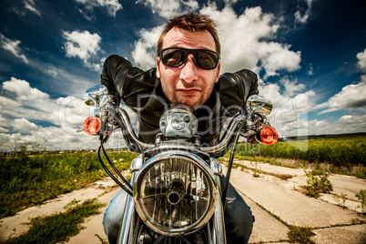 funny biker racing on the road