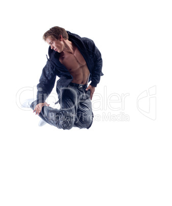 Young hip hop performer jumping in studio