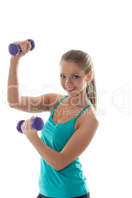 Portrait of cheerful young girl lifts dumbbells