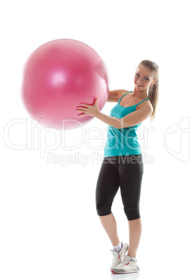 Funny girl posing in sportswear with pink ball